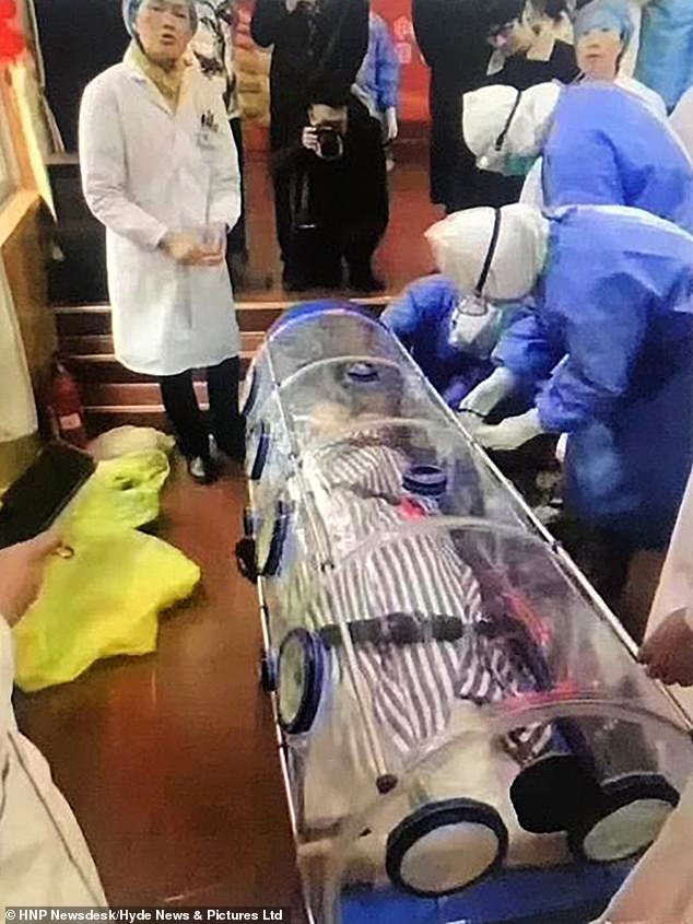 23741668 7916223 A suspected coronavirus patient was carried out of an airport in a 23 1579733978335