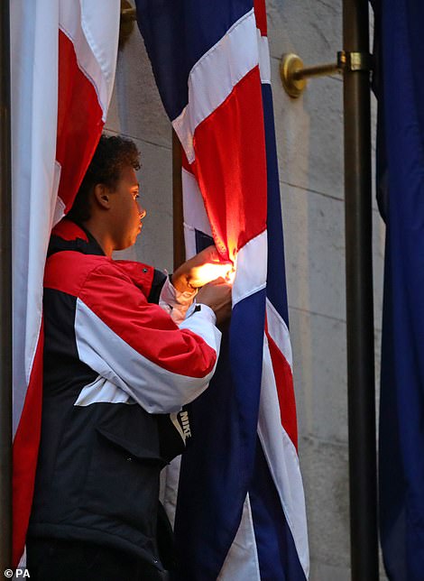 29337452 8401935 A protester tries to set fire to the Union Jack flag at the ceno a 49 1591772975571