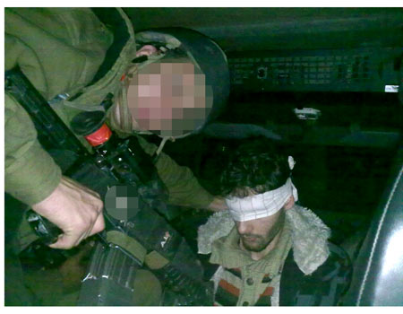 Soldiers pictured aiming rifle at Palestinian detainee 1 2 wh