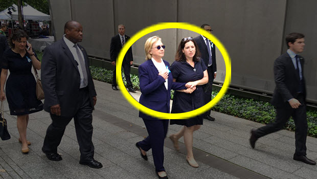 Who is this woman? Is she a doctor or a nurse? Whoever she is, she was just caught taking Hillary's pulse.