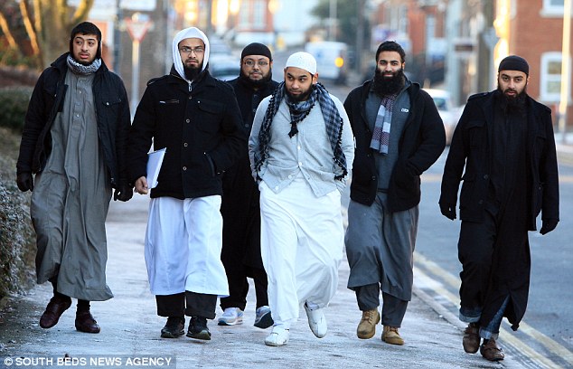 Protesters: (from left to right) Jabair Ahmed, Shajjadar Choudhury, Ziaur Rahman, Jalal Ahmed, Munim Abdul and Yousaf Bashir arrive at Luton Magistrates Court