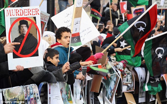 Gaddafi flees Tripoli as protesters set the Libyan parliament building alight 16 article 1358972 0D3DD9E2000005DC