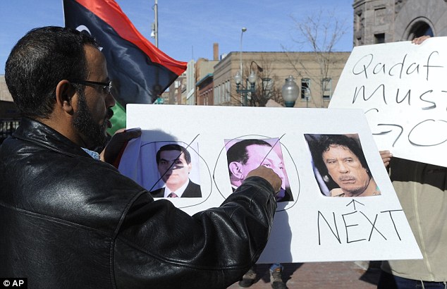 Gaddafi flees Tripoli as protesters set the Libyan parliament building alight 25 article 1358972 0D42B0D7000005DC