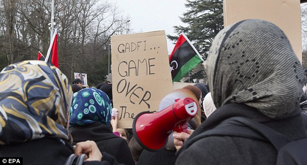 Gaddafi flees Tripoli as protesters set the Libyan parliament building alight 17 article 1358972 0D4450AD000005DC