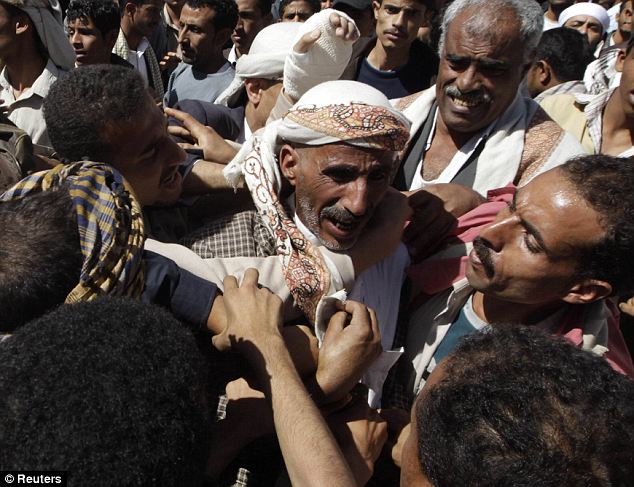Gaddafi flees Tripoli as protesters set the Libyan parliament building alight 22 article 1358972 0D476B02000005DC