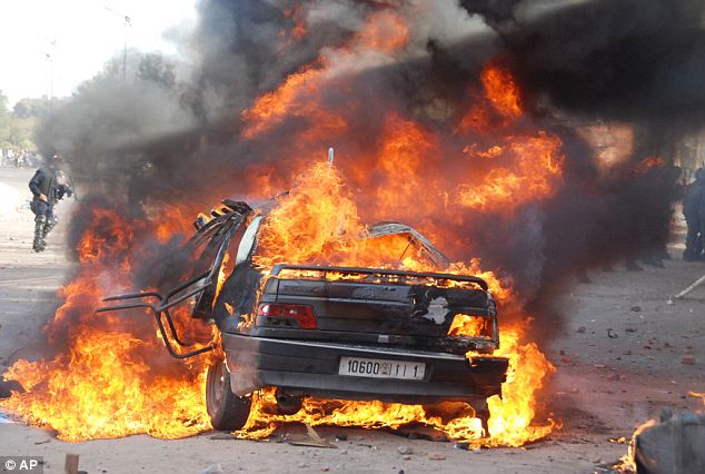 Gaddafi flees Tripoli as protesters set the Libyan parliament building alight 19 article 1358972 0D48AD39000005DC