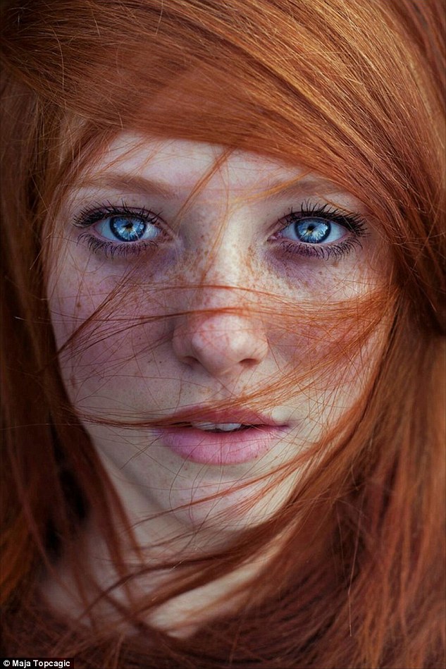 2AE2BDD300000578 3176475 One woman is seen with her flame coloured hair dishevelled tendr a 17 1438071239059