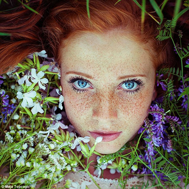 2AE2BDD700000578 3176475 Another young woman looks up into the camera from a bed of purpl a 23 1438071260133