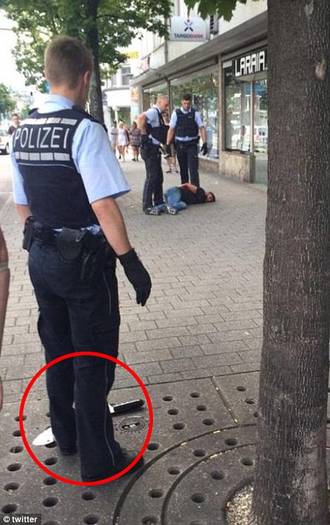 368E964300000578 3705823 Pictures from the scene appear to show the knifeman lying on the a 48 1469380764024
