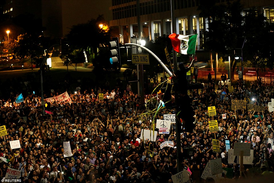 3A38BF8400000578 3922098 Los Angeles Protester waves a Mexican flag outside City Hall in a 19 1478776851431