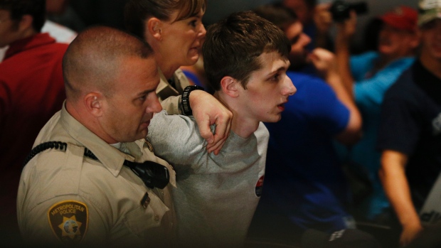 Donald Trump assassin Michael Sandford (center) being apprehended by US police